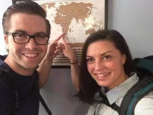 Chris and I pointing at our map with backpacks on