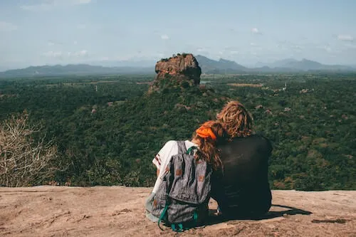 Couples overlooking rock monument in Sri Lanka