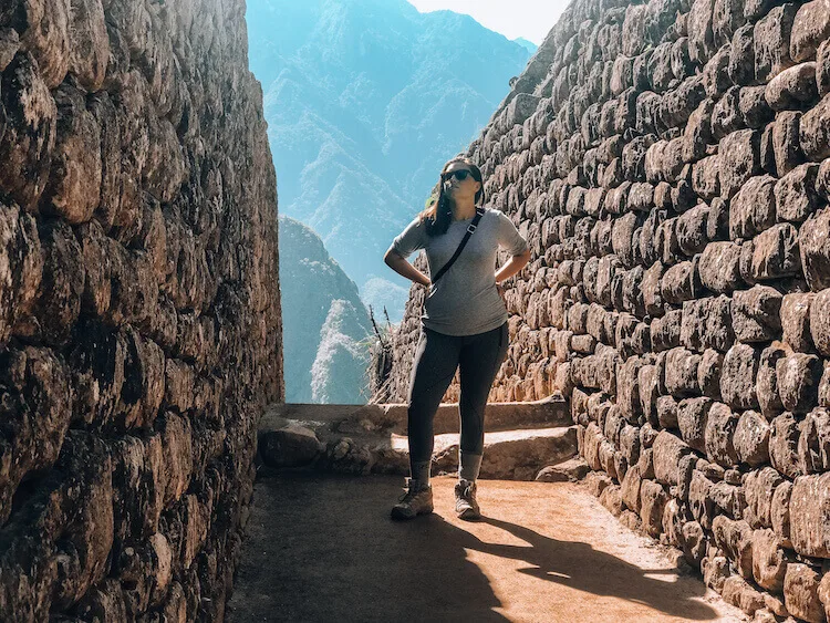 Kat exploring the ruins of Machu Picchu - Peru itinerary