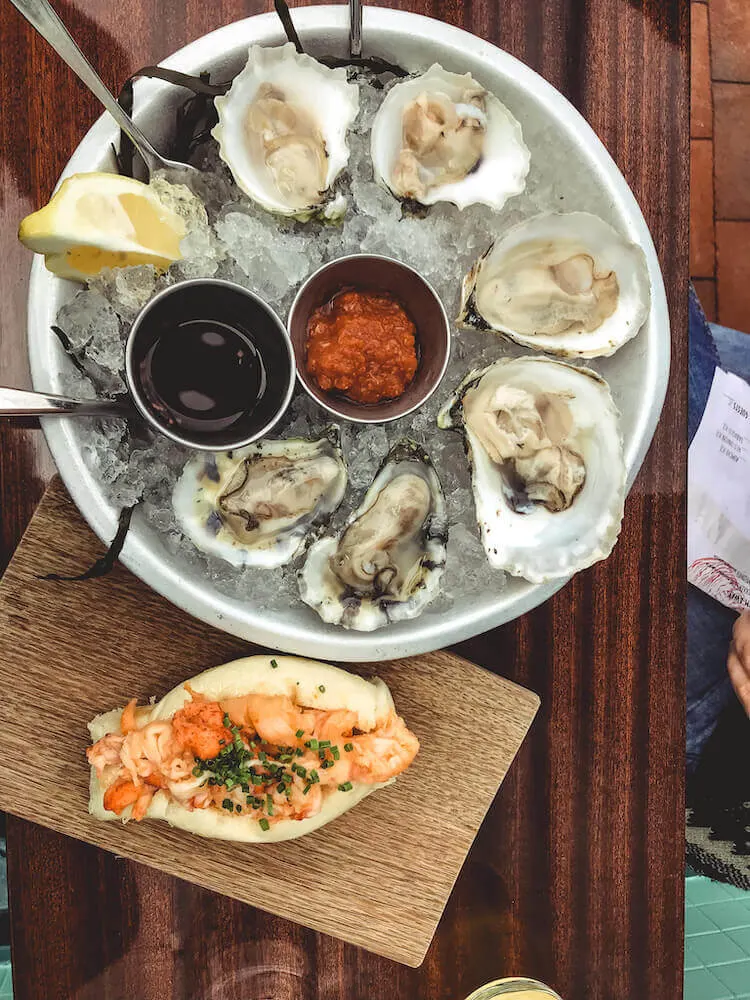 oysters and lobster roll at Eventide Oyster Co - Best Lobster rolls in Portland Maine