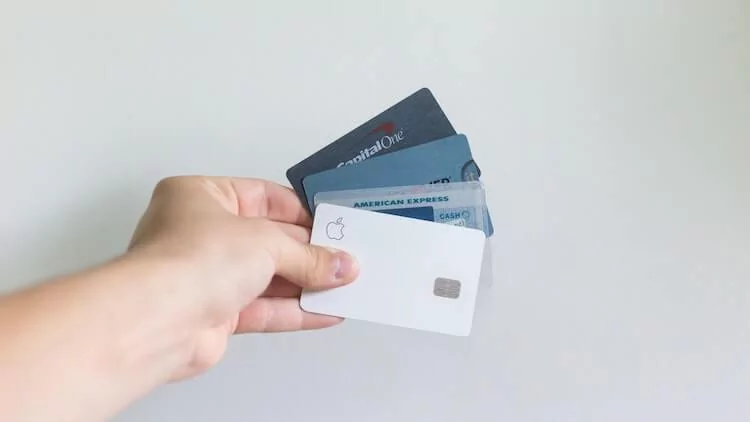 Several Credit Cards held in person's hand