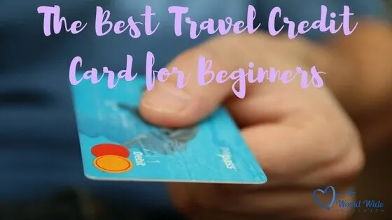Best Travel Credit Card for Beginners title photo of hand holding credit card
