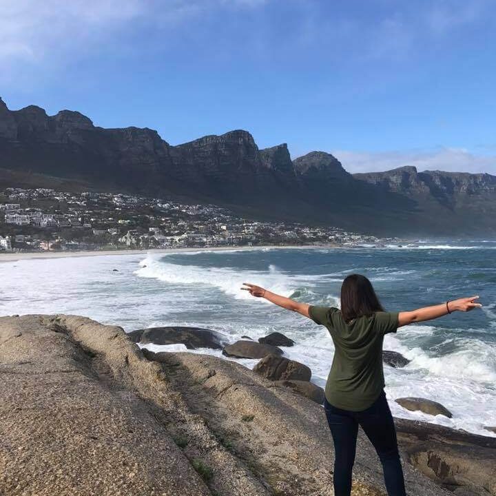 Kat facing the ocean in Camps Bay. Why I Decided to Leave My Corporate Job article.