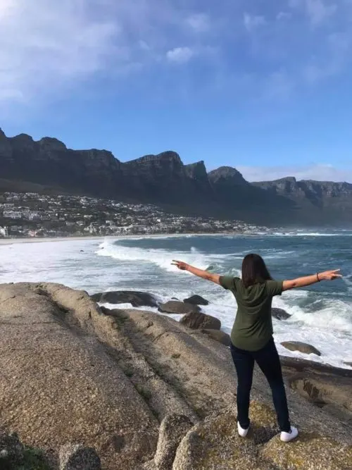 Kat facing the ocean in Camps Bay. Why I Decided to Leave My Corporate Job article.