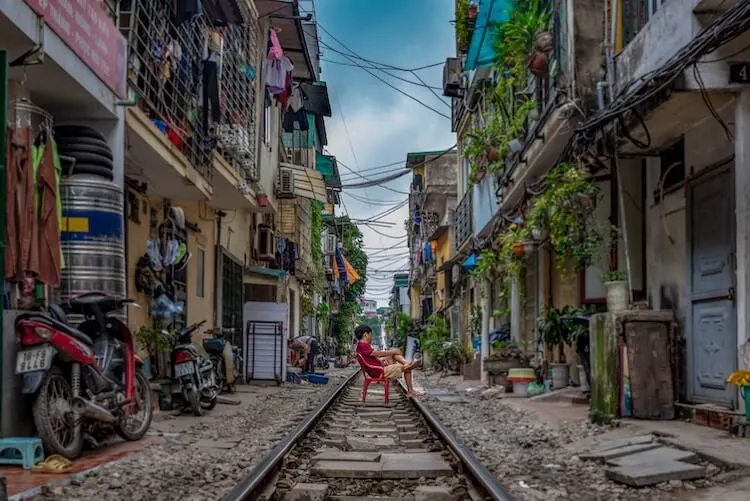 Person lounged on train street in Hanoi in a day