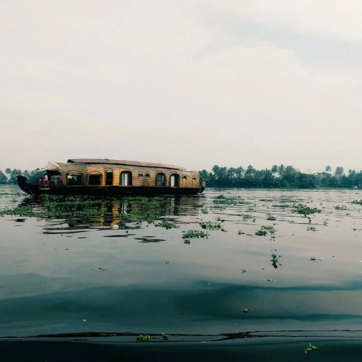 Kerala houseboat floating on river