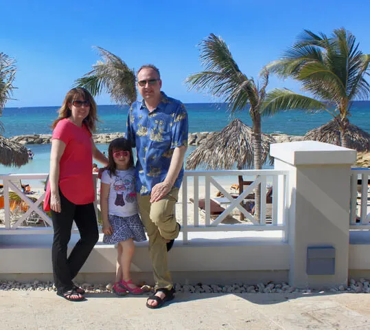 Christine, Kevin, and their daughter in Jamaica