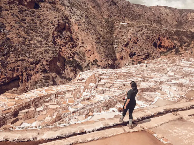 Kat exploring the salt pools at the Maras Salt Mines in the Sacred Valley