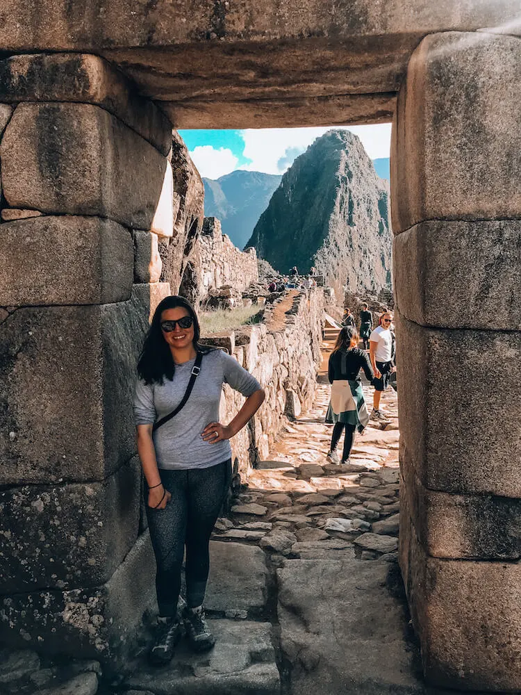 Kat posing at the entrance of Machu Picchu