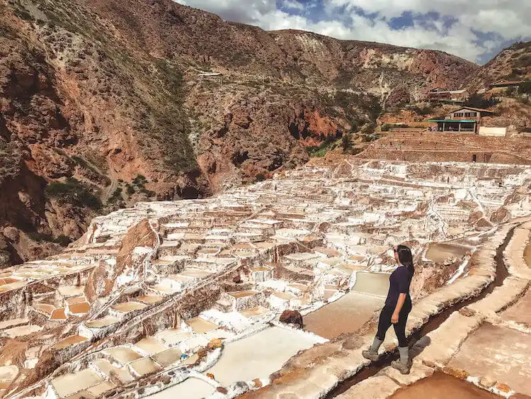 Kat wandering along the salt pools at Maras Salt Mines in Sacred Valley, Peru