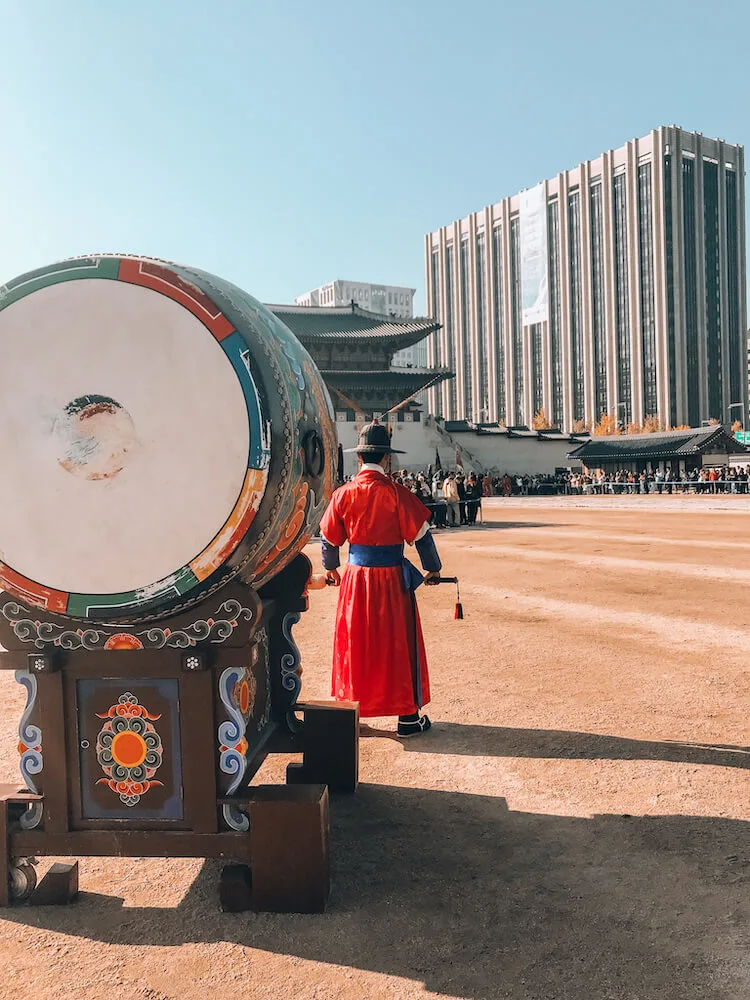 Man and drum outside of Gyeongbokgung Palace in Seoul