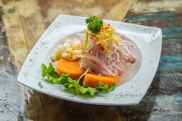 plate of ceviche with sweet potato and corn