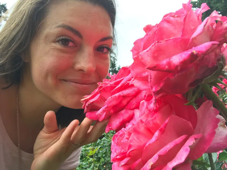 Kat smelling roses at the International Rose Test Garden