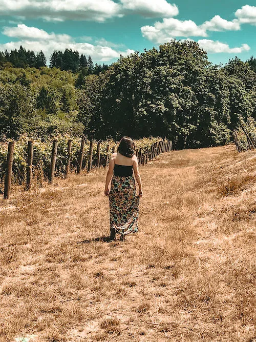 Kat wandering through the vineyards on her day trip from Portland