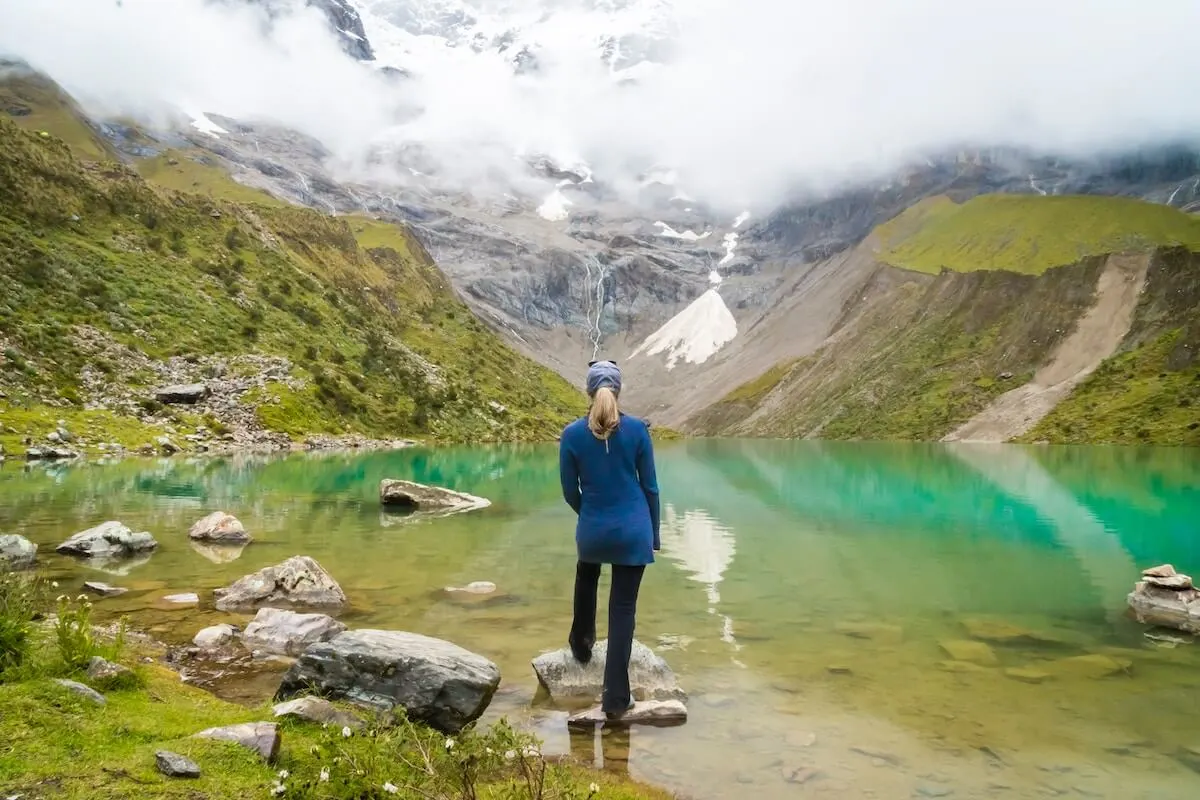 Woman hiking Humantay Lake in Peru as a day trip from Cusco