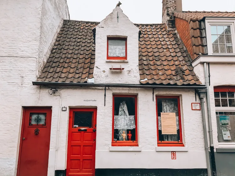 A day in Bruges-white building with red door