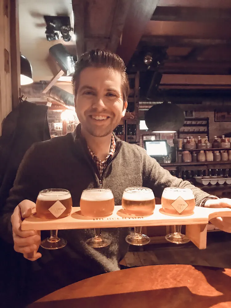 Chris with his flight of beer at Bier Central - Where to drink beer in Antwerp