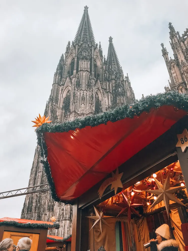 Cologne Cathedral Christmas Market stand with church in background