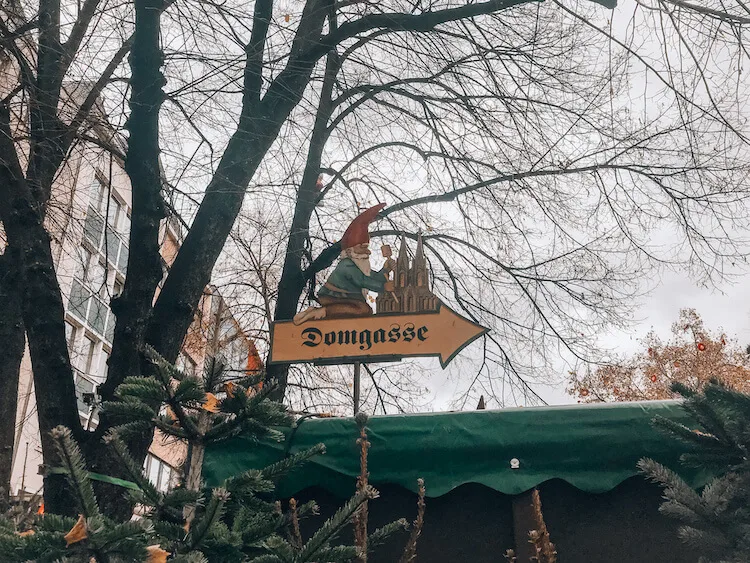 Gnome on a sign at the Alter Market Christmas market in Cologne - Christmas Markets in Cologne Germany