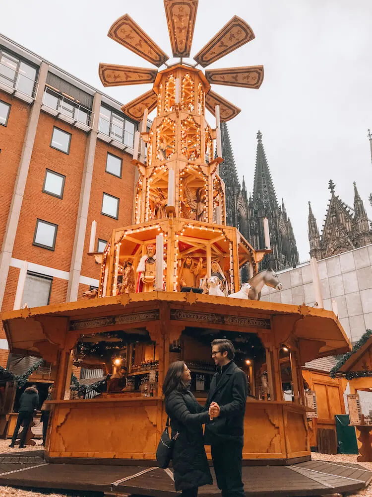 Kat and Chris in front of the Christmas pyramid in Cologne