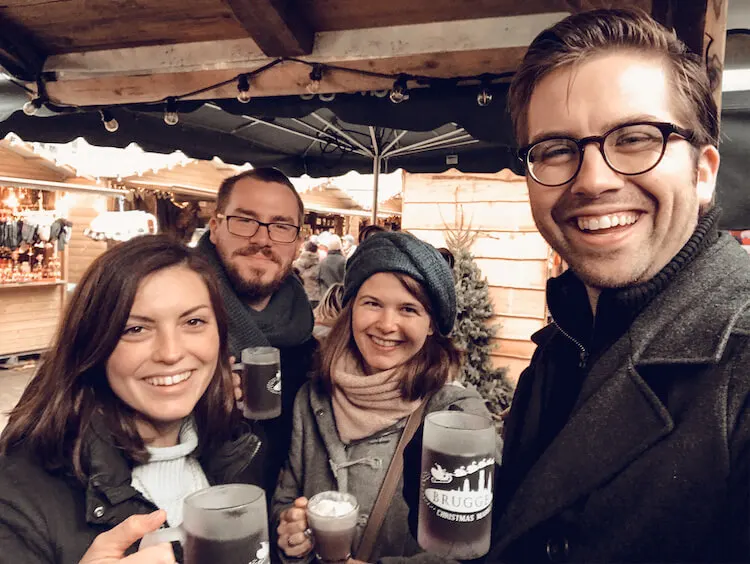 Kat and Chris with their friends at the Bruges Christmas market