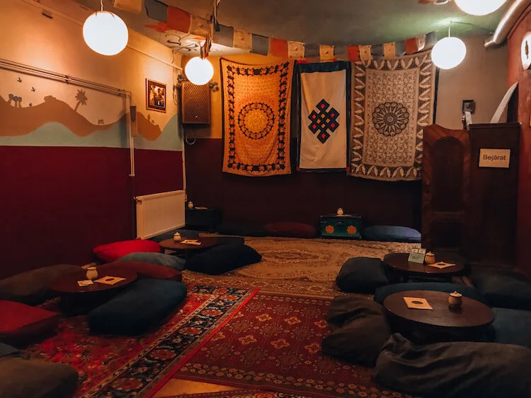 Sirius Teahouse main room with poofs as chairs in Budapest, Hungary