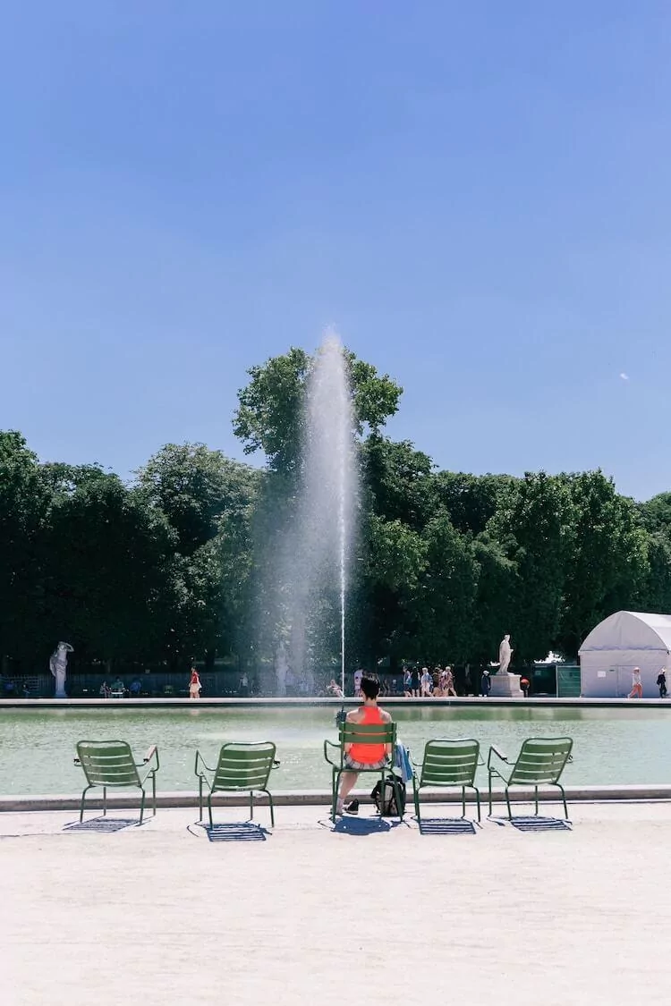 Chairs in front of the fountain at Tuileries Garden - One Day in Paris