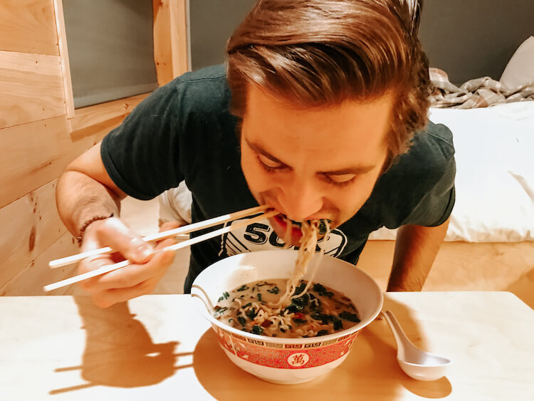 Chris eating the ramen we prepared in our cabin in Ohio