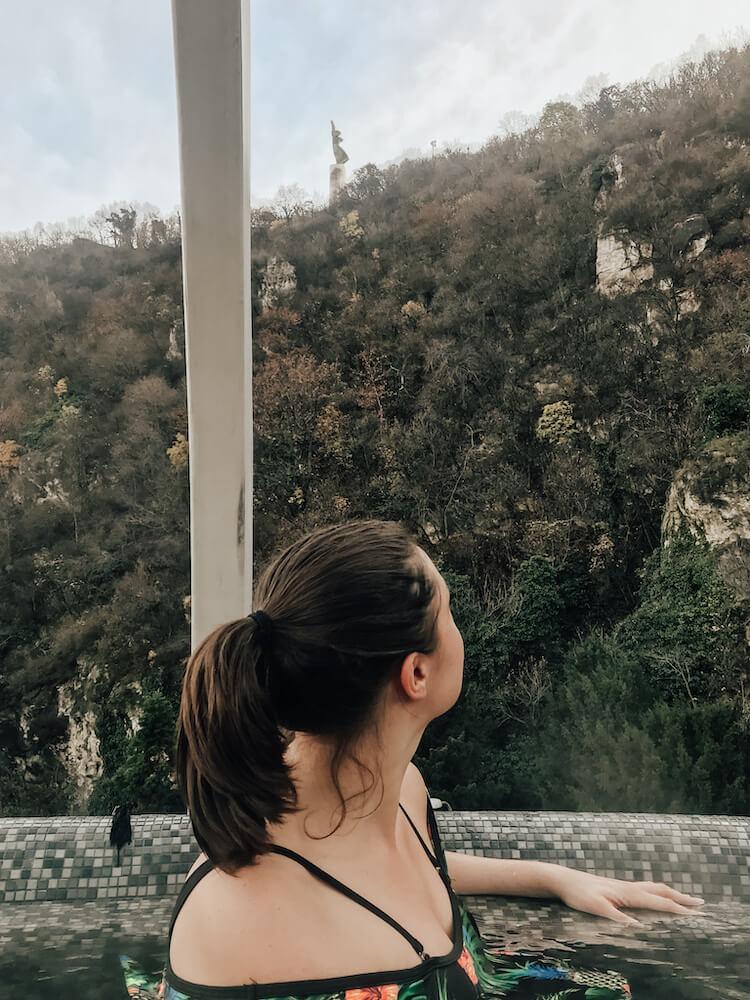 Kat looking at the Gellert hill from the best bath in Budapest