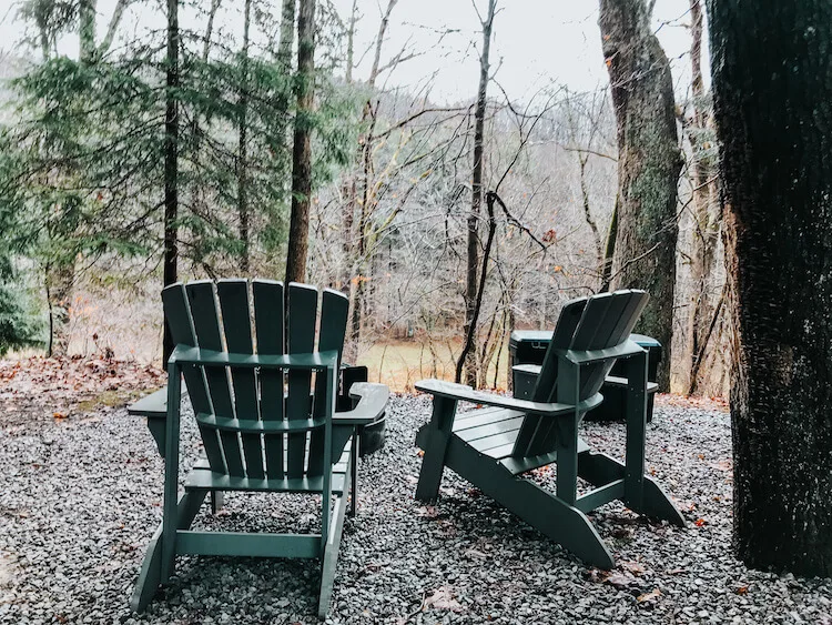 Outside of the cabin getaway in Ohio showing the firepit and chairs