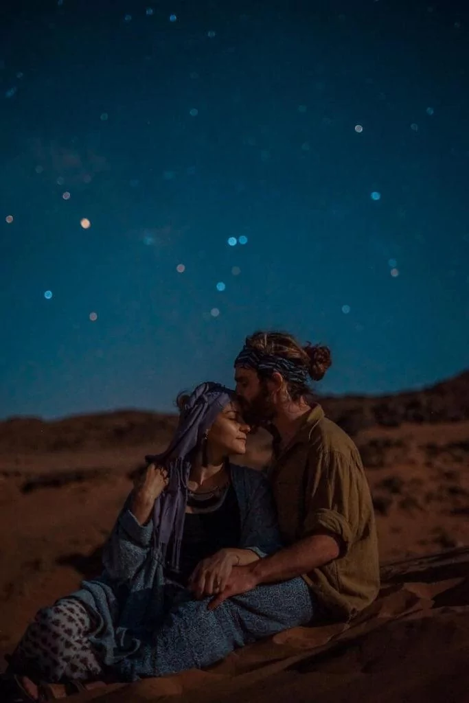 Couple admiring the starts in the Sahara Deset- Couple's Travel Bucket List