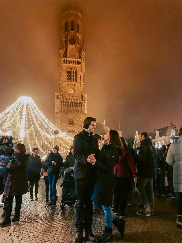 Kat and Chris in Bruges at the Christmas Market- Best Bucket List Ideas for Couples Who Travel