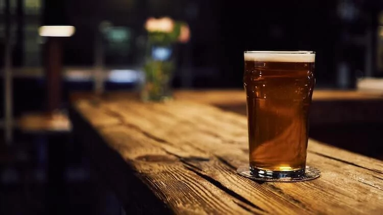 Single craft beer on a wooden table