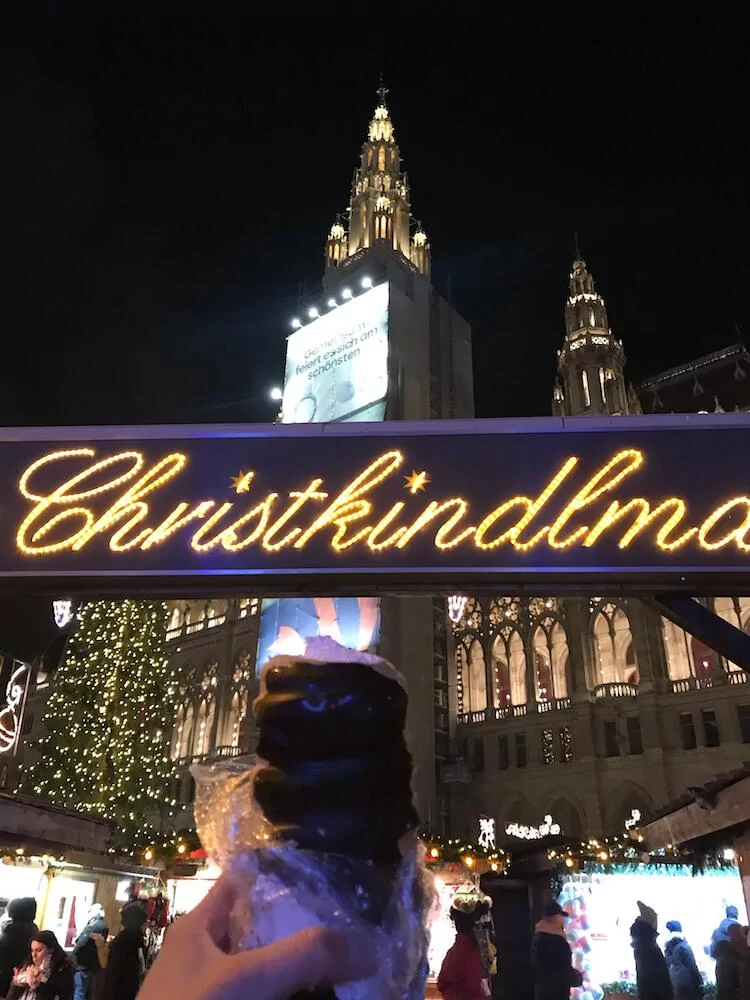 Chimney Cake with cream at the Rathausplatz Christmas market in Vienna