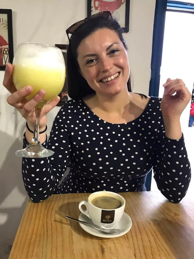 Kat with coffee and juice in Cusco