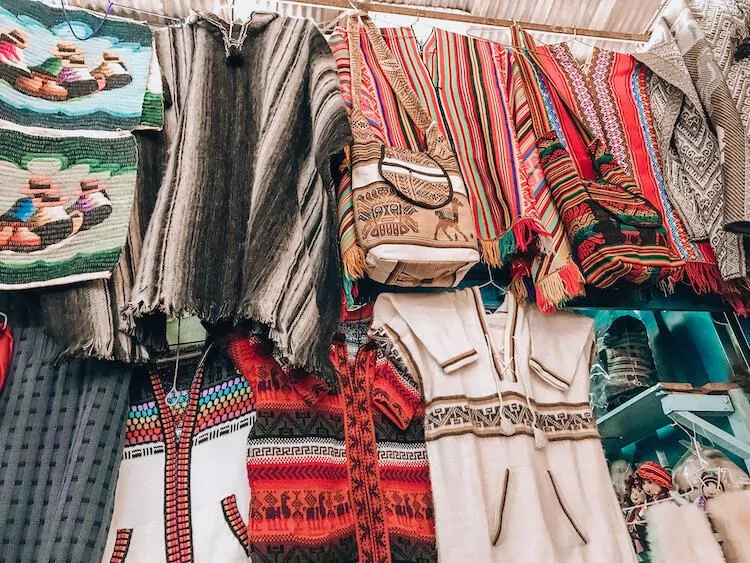 Peru sweaters at a market in Peru - Best Peruvian Souvenirs