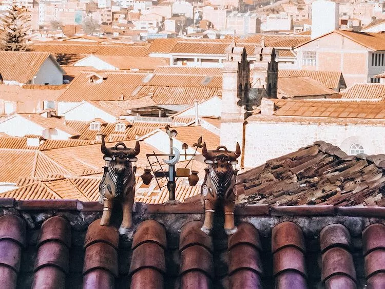 Pucara Bulls sitting on top of a roof in Cusco - Cusco souvenirs