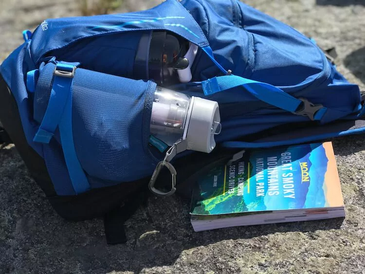 Close up of the Moon Travel Guide with my backpack