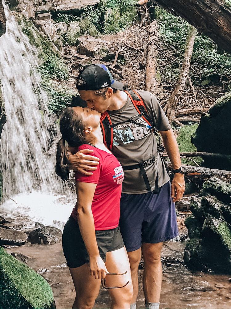 Kat and Chris kissing at Baskin Creek Falls in the Great Smoky Mountains
