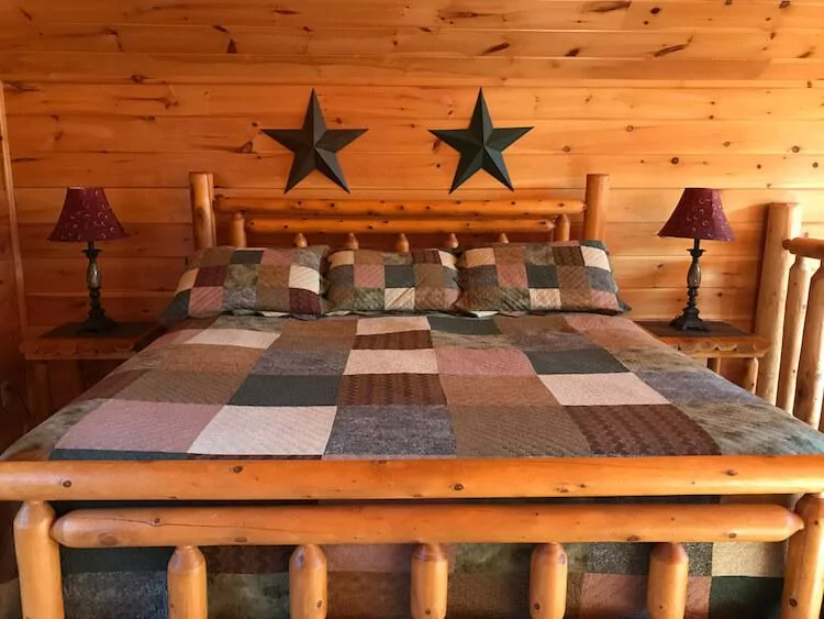 Quilted bed in our Airbnb Cabin in the Smoky Mountains