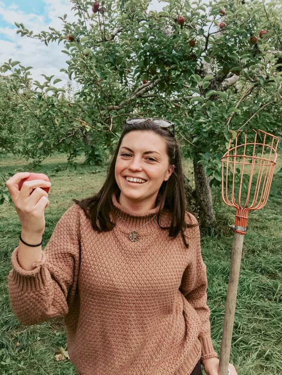 Kat picking apples at Shelburne Orchards - Road Trip Vermont