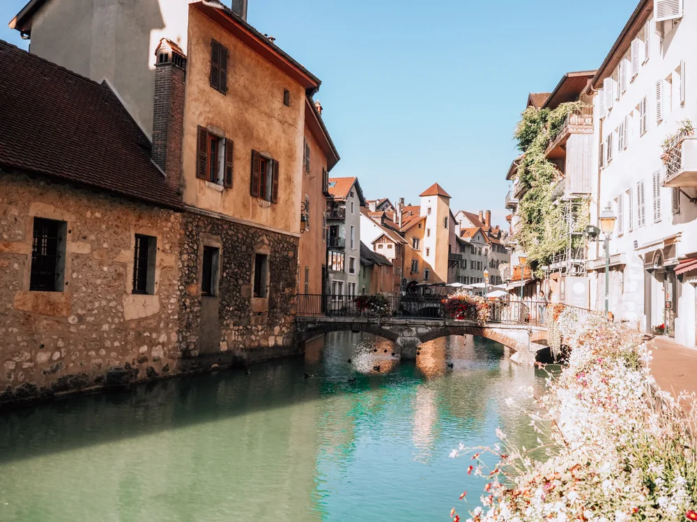 Canal in Annecy with a bridge in the middle