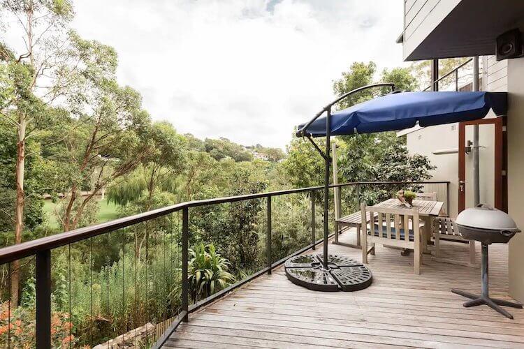 Hidden Hideaway with lots of greenery on the back deck of a Sydney Airbnb