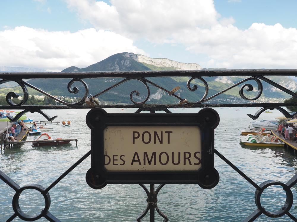 Pont Des Amours sign on the bridge overlooking the lake