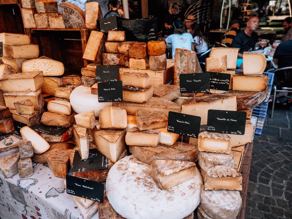 Stacks of cheese at the Annecy Farmer's Market