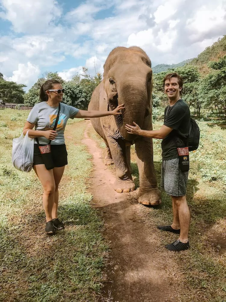 Kat and Chris at Elephant Nature Park with Sai Thong the elephant