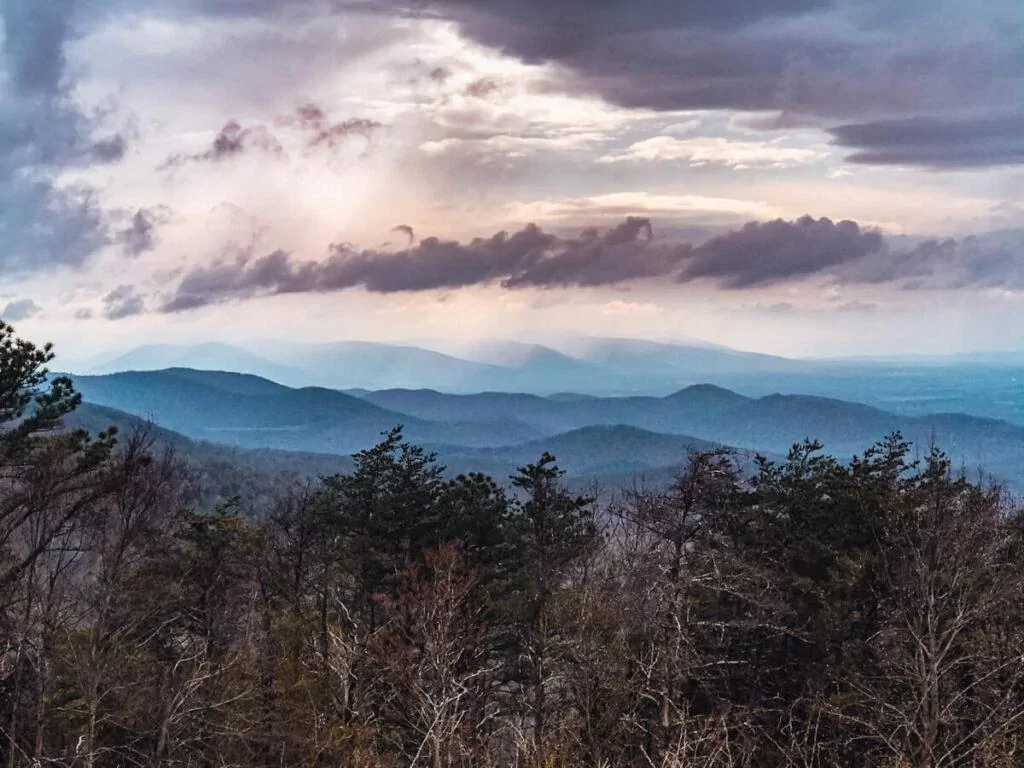 Best Things to do in Shenandoah National Park - Shenandoah National Park around the evening with the sun poking through the clouds over rolling mountains