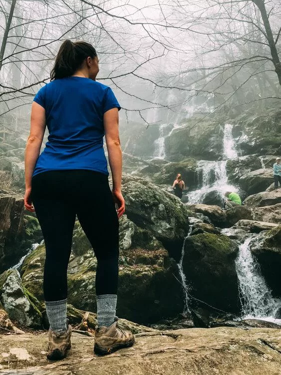 Kat posing and looking at Dark Hollow Falls