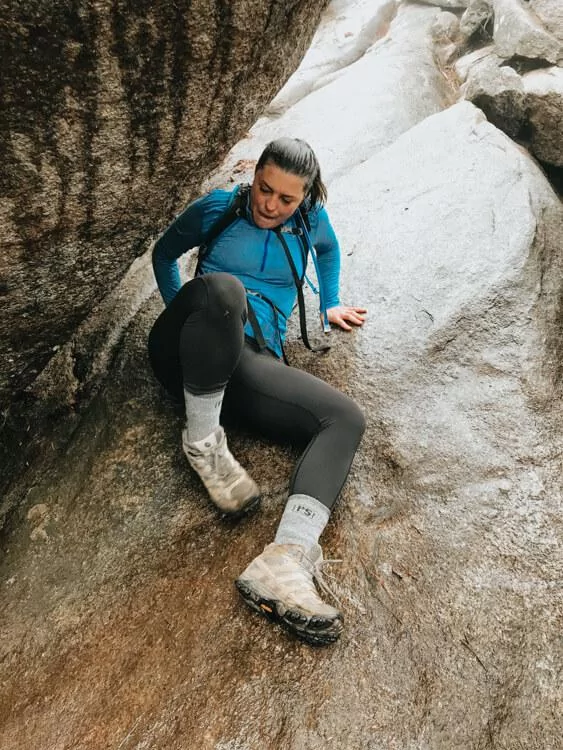 Kat scooting up a rock scramble backwards