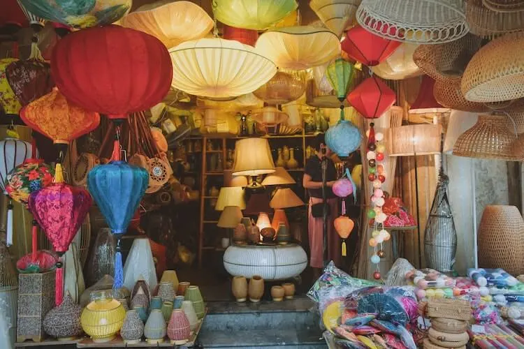 Lamps and baskets surrounding the entryway of a shop in Hanoi